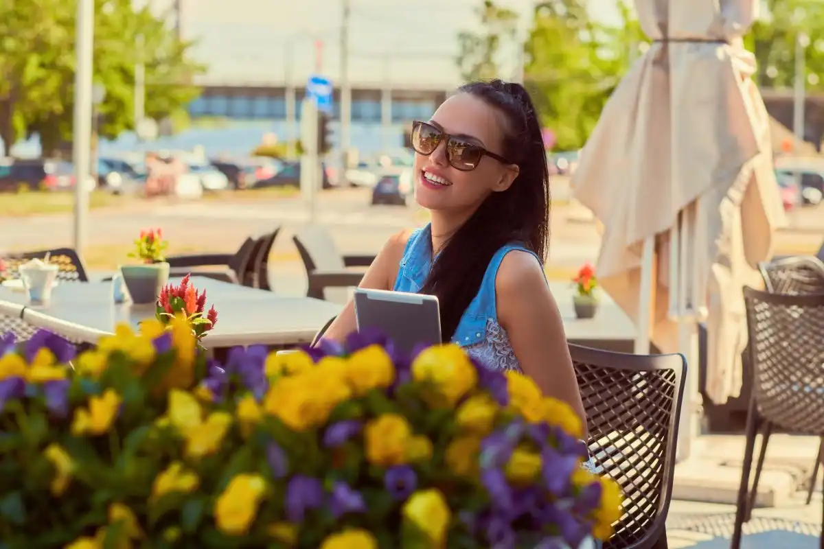 Young teenage girls recording reels of themselves outdoors for social media
